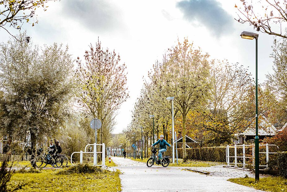 Wohnsiedlung mit Mensch und Rad im Mittelpunkt